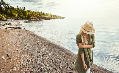 Buy stock photo Thinking, relax and woman at lake, nature and tourism with weekend break, flare and water. Contemplation, travel or person with journey, walking and explore with adventure or holiday in Canada