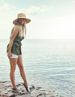 Buy stock photo Portrait of an attractive young woman spending a day at the lake