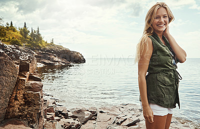 Buy stock photo Portrait of an attractive young woman spending a day at the lake