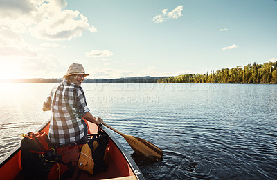 Buy stock photo Portrait of an attractive young woman spending a day kayaking on the lake