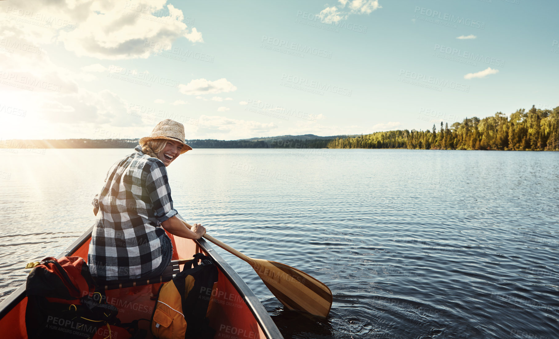 Buy stock photo Portrait of an attractive young woman spending a day kayaking on the lake