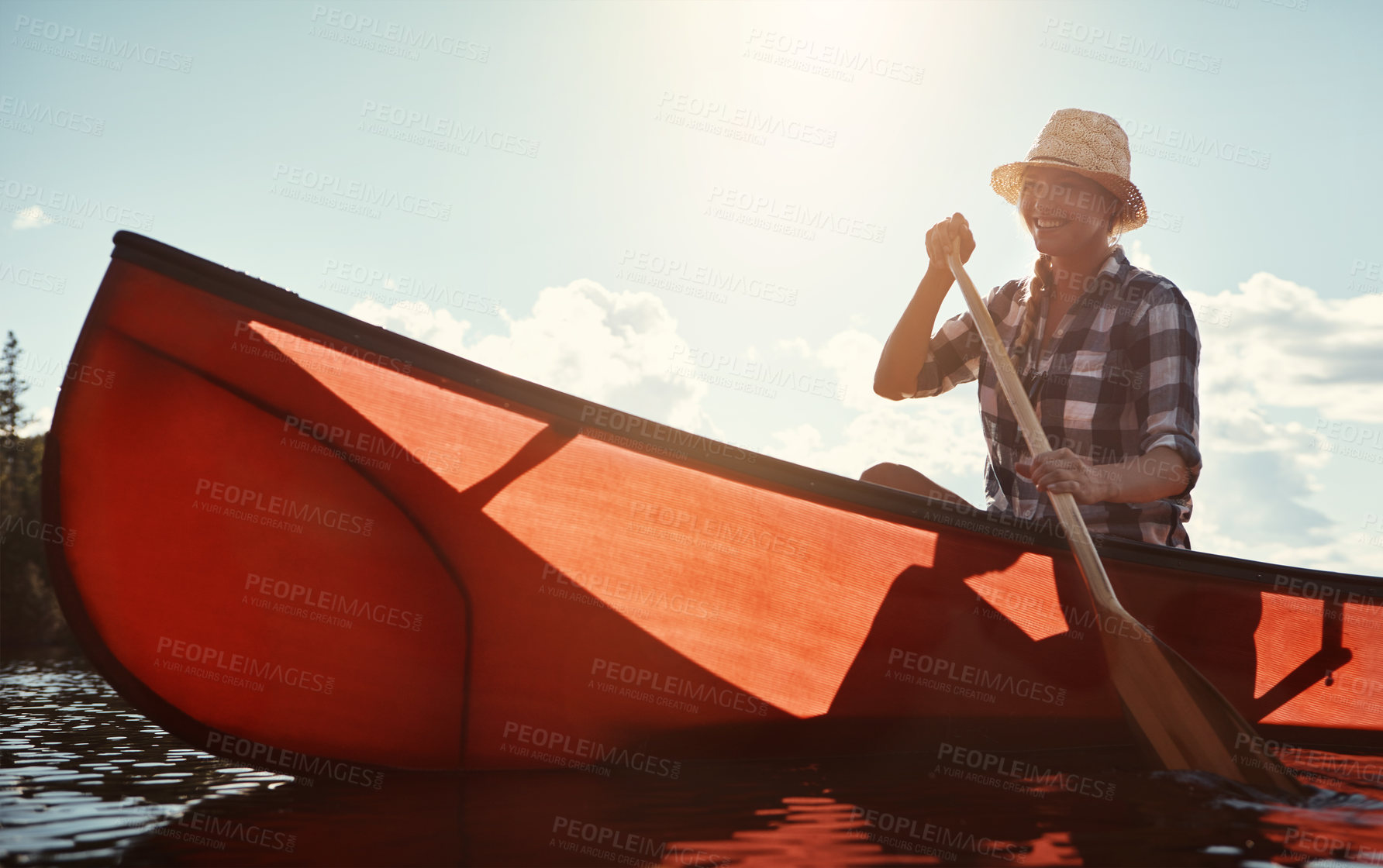 Buy stock photo Holiday, woman and smile with canoeing on lake for travel adventure, weekend activity and paddle. Sunshine, person and rowing in boat for vacation journey, exploring nature and freedom in countryside