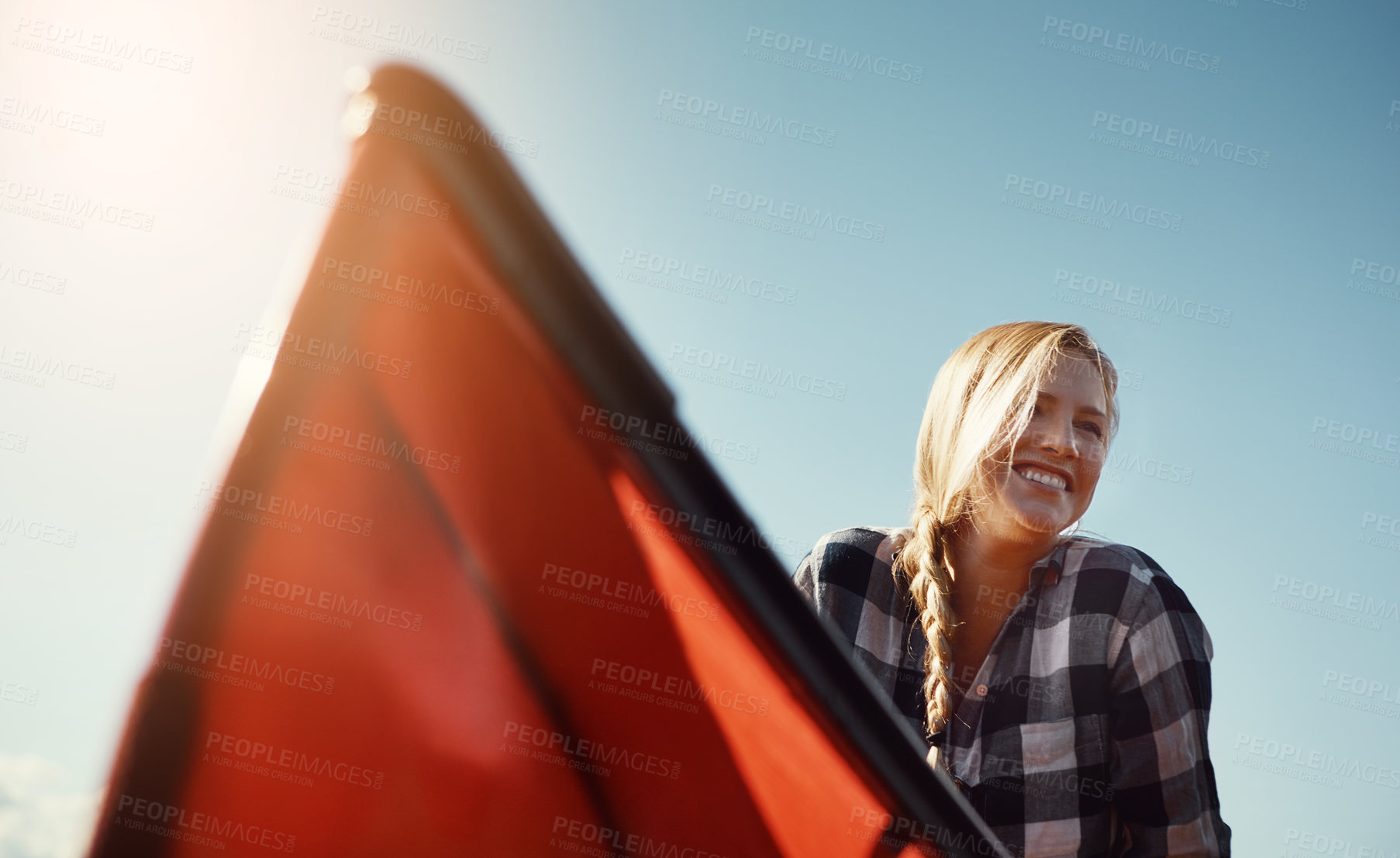 Buy stock photo Shot of an attractive young woman spending a day kayaking on the lake