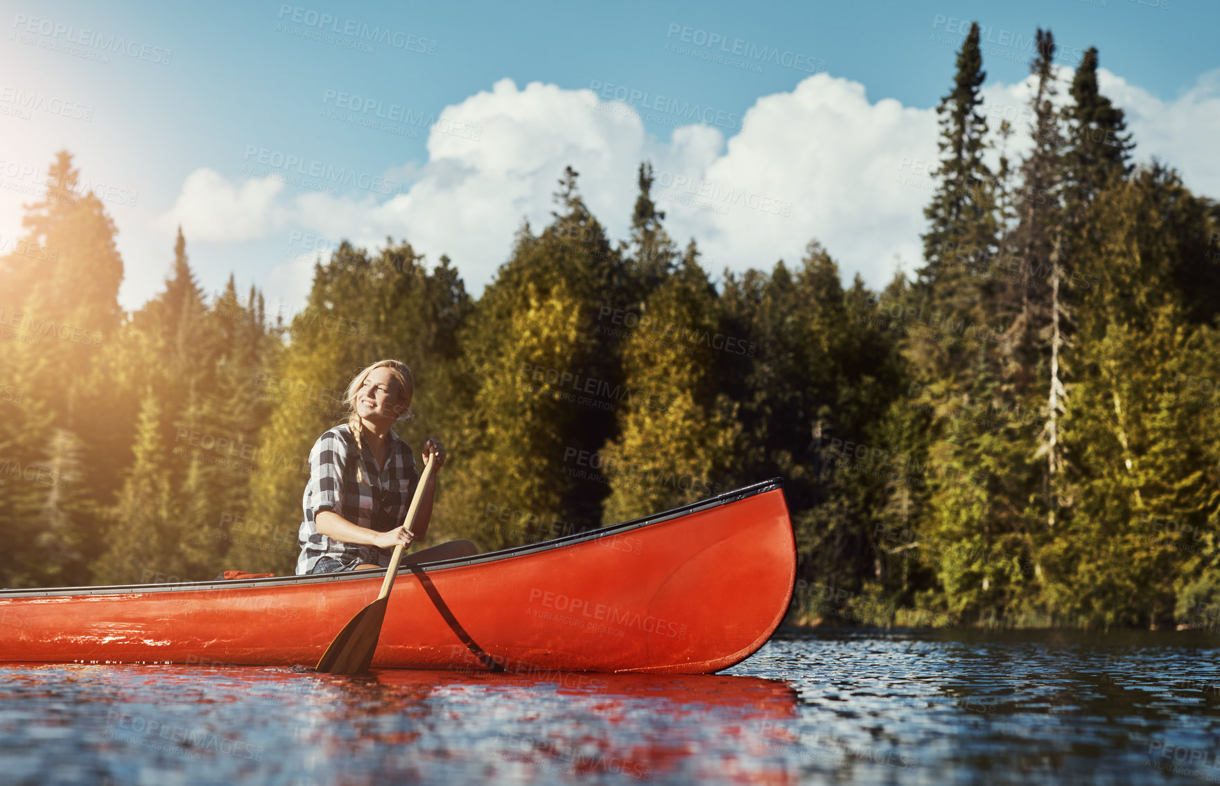Buy stock photo Canoeing, lake and woman on boat in nature on holiday, adventure or weekend trip with exploring. Travel, rowing and female person with kayaking challenge on river for summer vacation outdoor.