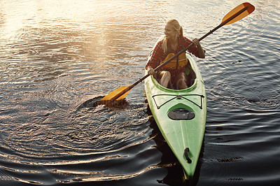 Buy stock photo Shot of an attractive young woman out for canoe ride on the lake