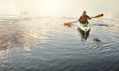 Buy stock photo Shot of an attractive young woman out for canoe ride on the lake