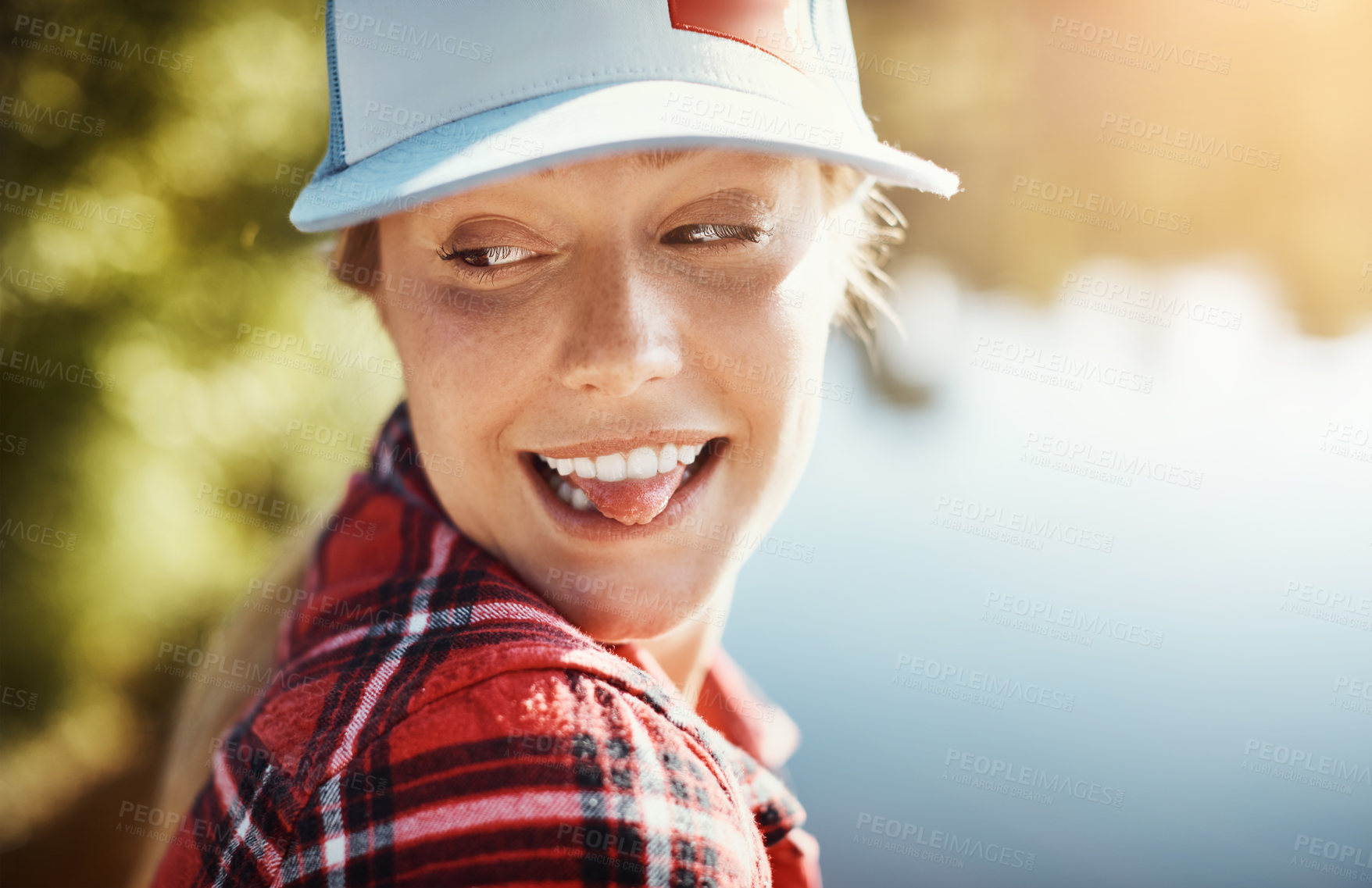 Buy stock photo Shot of a young woman relaxing alone in nature