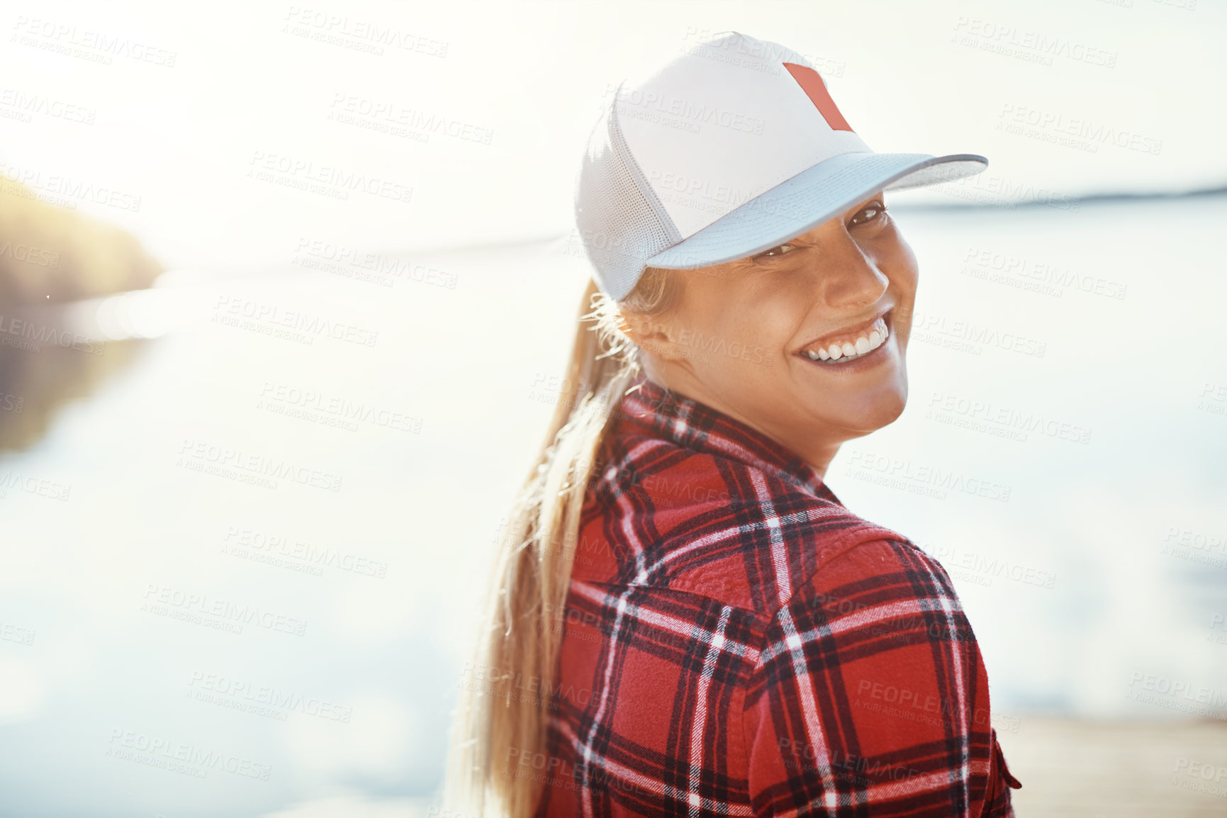 Buy stock photo Shot of a young woman relaxing alone in nature