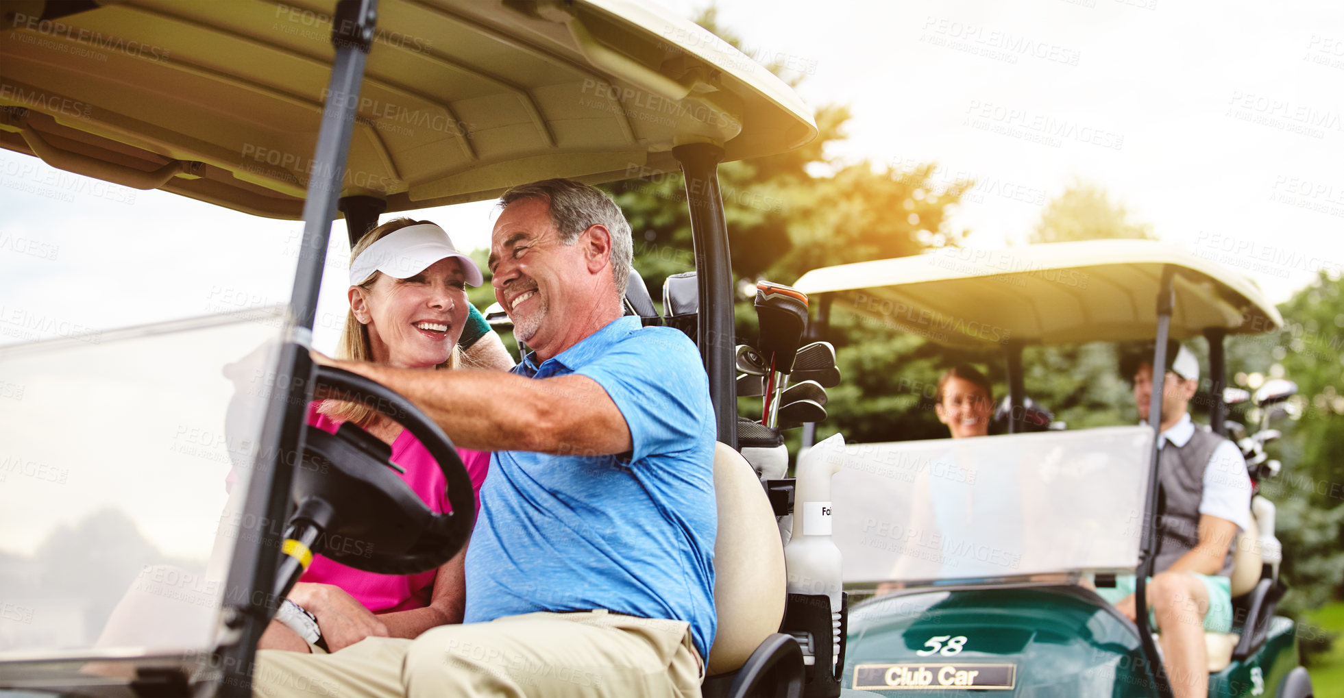 Buy stock photo Shot of an affectionate mature couple spending a day on the golf course