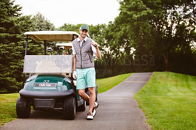 Buy stock photo Full length portrait of a handsome young man leaning against a golf cart on a golf course