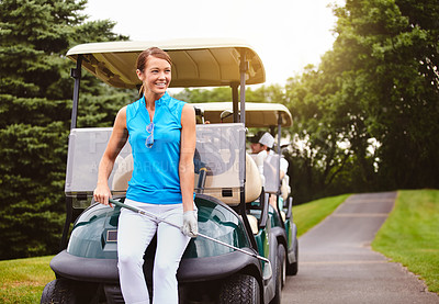 Buy stock photo Cropped shot of an attractive young woman leaning against a golf cart on a golf course