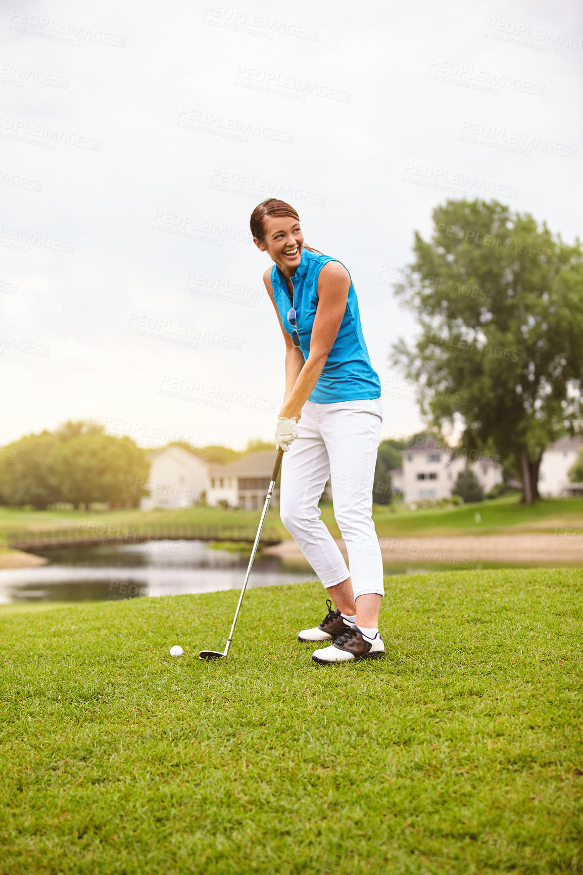 Buy stock photo Full length shot of an attractive young woman playing a round of golf on a golf course