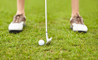 Buy stock photo Cropped shot of an unrecognizable woman out playing golf on a golf course