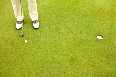 Buy stock photo Shot of a mature man out playing golf in his free time