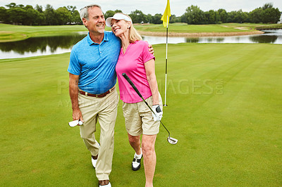 Buy stock photo Love, mature couple and club for golf sport, physical activity and bonding through recreation. Happy people, man and woman for walking in nature for friendly competition, game or fun outdoor with hug