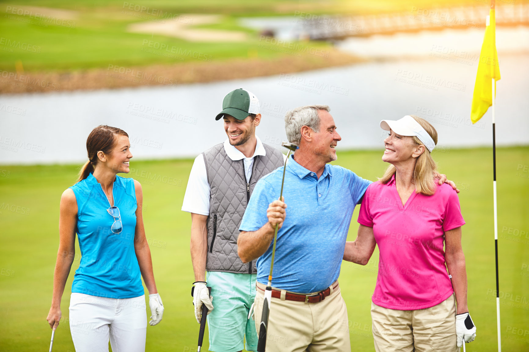 Buy stock photo Shot of four people out on a double date on a golf course