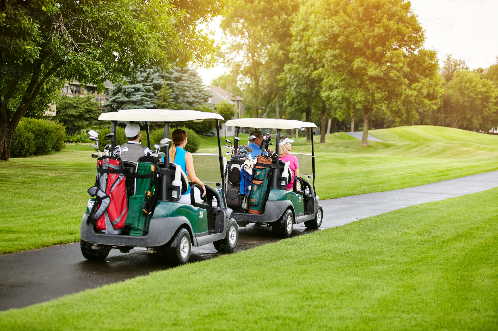 Buy stock photo Shot of four people out on a double date on a golf course