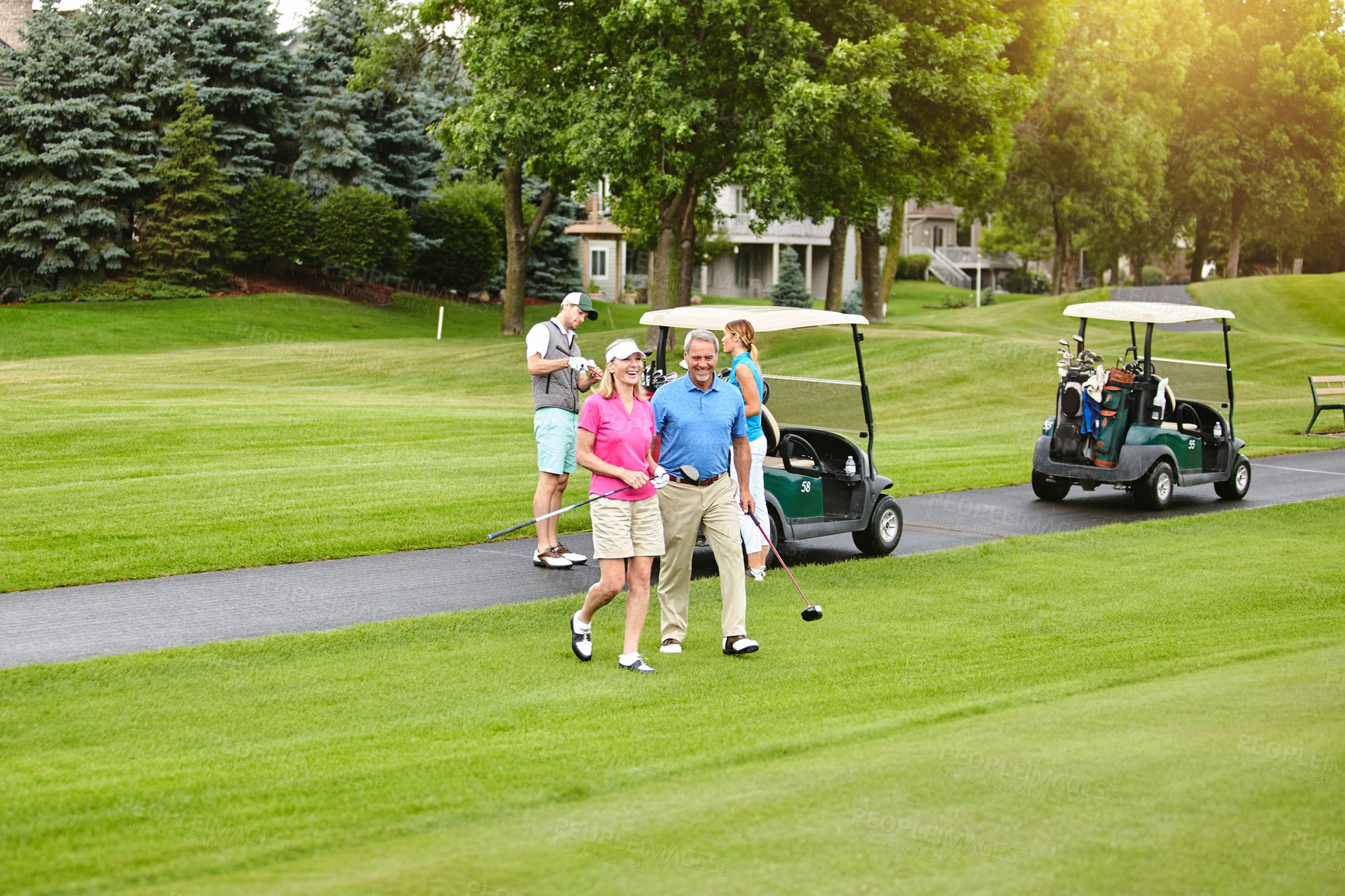 Buy stock photo Shot of a mature couple out playing golf together