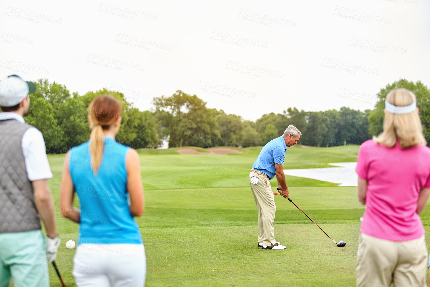 Buy stock photo Shot of four people out on a double date on a golf course