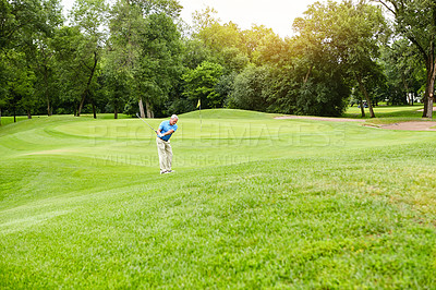 Buy stock photo Shot of a mature man on a golf course