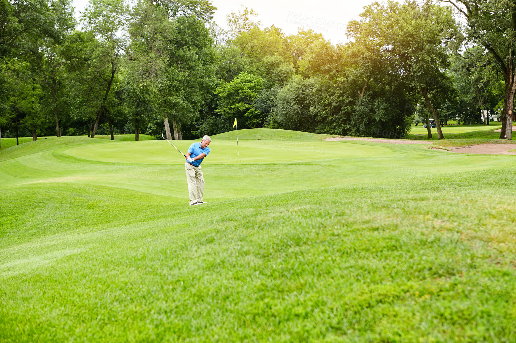 Buy stock photo Shot of a mature man on a golf course