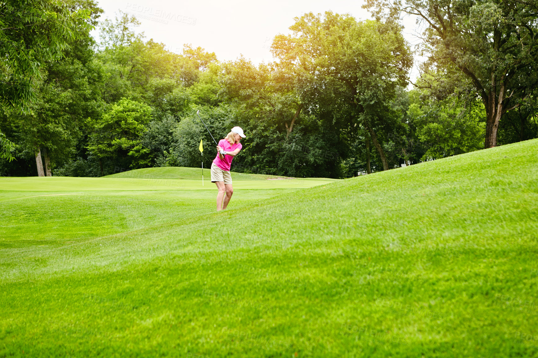 Buy stock photo Shot of a mature woman on a golf course