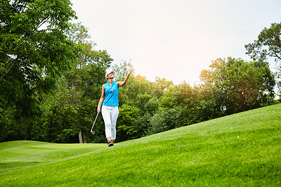 Buy stock photo Woman, golf and walking with ball in air, exercise or fitness with birdie success or handicap achievement. Female athlete, game and driver on course, outdoor for sports challenge with par hole