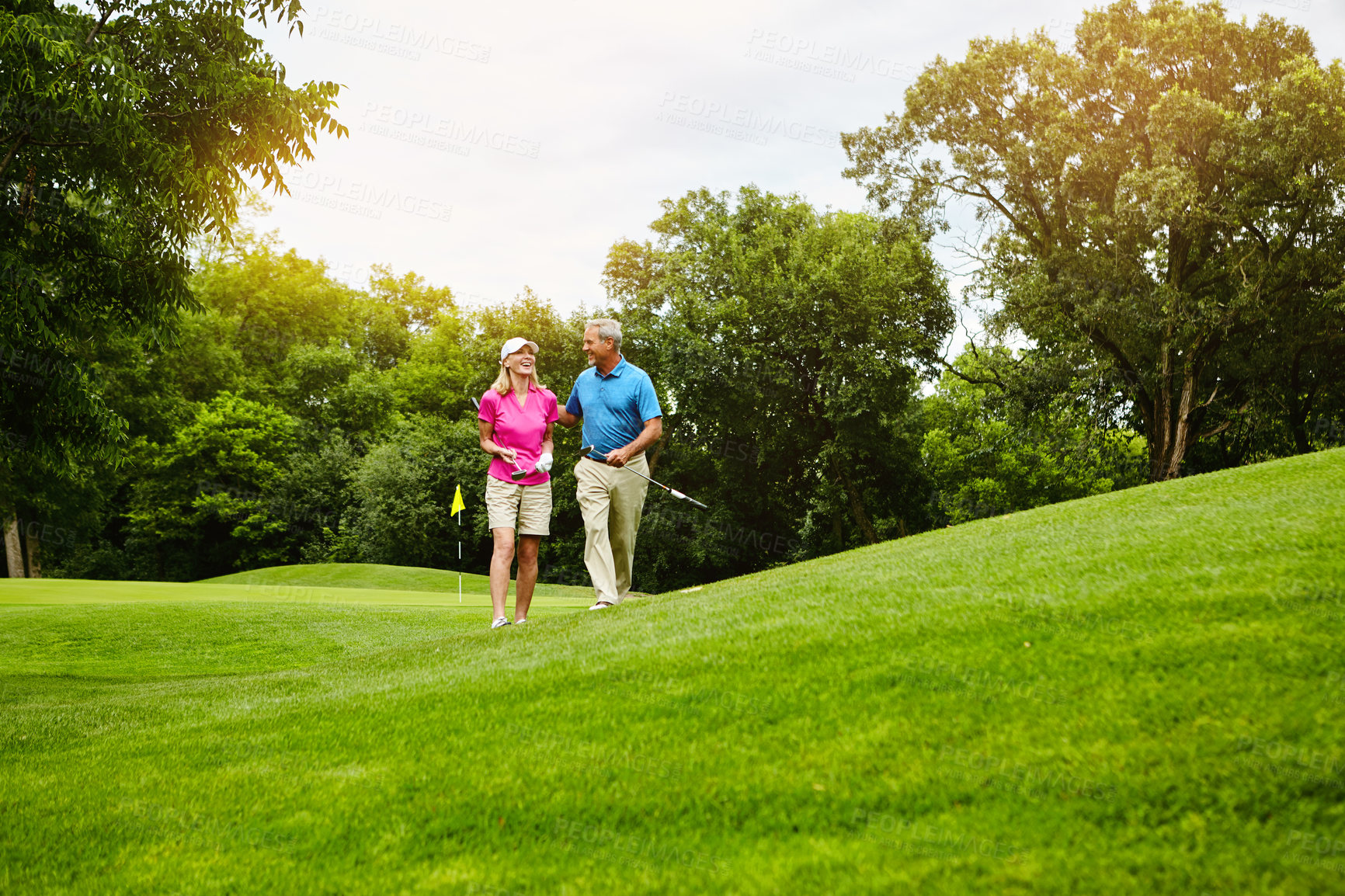 Buy stock photo Shot of a mature couple on a golf course