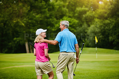 Buy stock photo Shot of a mature couple on a golf course
