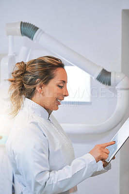 Buy stock photo Research, woman or dentist on tablet in clinic for appointment schedule or mouth healthcare. Professional, technology or dental doctor on touchscreen in clinic for tooth cleaning services in England 