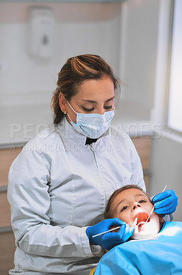 Buy stock photo People, dentist and examination with child in hospital for procedure or consultation in oral care clinic. Woman, patient and mask with tools as orthodontist for teeth cleaning or root canal treatment