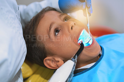 Buy stock photo Hands, child and dental curing light for cleaning teeth, health and oral hygiene at pediatric clinic. Boy, dentist and uv treatment for tooth, closeup and orthodontics tools for filling cavity or dry