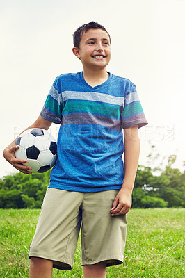 Buy stock photo Nature, thinking and boy child with soccer ball in outdoor park for development, idea or hobby. Grass, sports and young kid with smile in playground for happiness, solution or football game in Canada