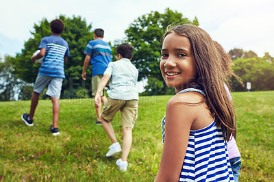 Buy stock photo Shot of a group of young friends hanging out together in the park