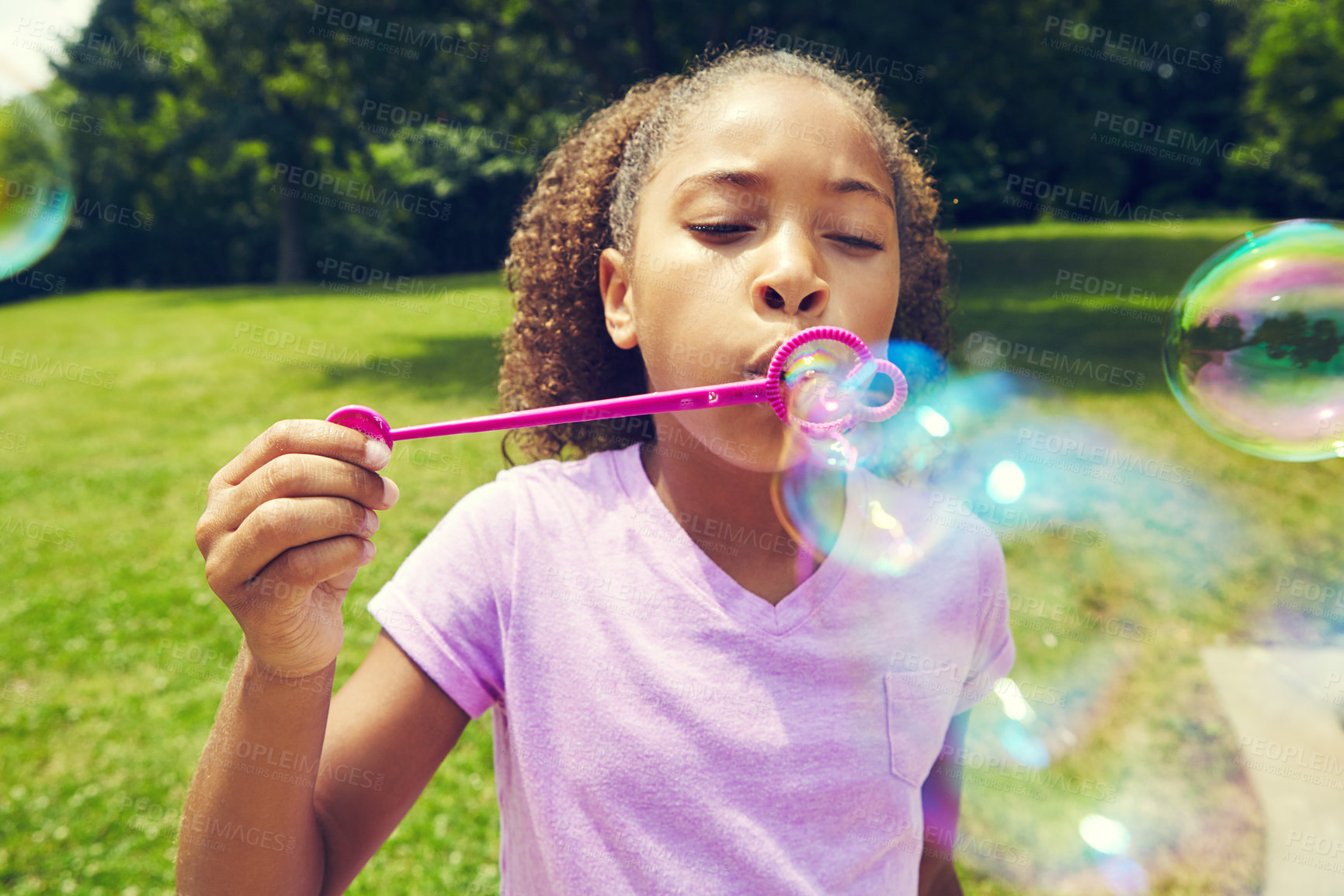 Buy stock photo Children, toys or African girl with bubbles in park for fun, learning and garden, vacation or games in nature. Soap, wand or kid in forest with foam magic, hobby or weekend, entertainment or travel