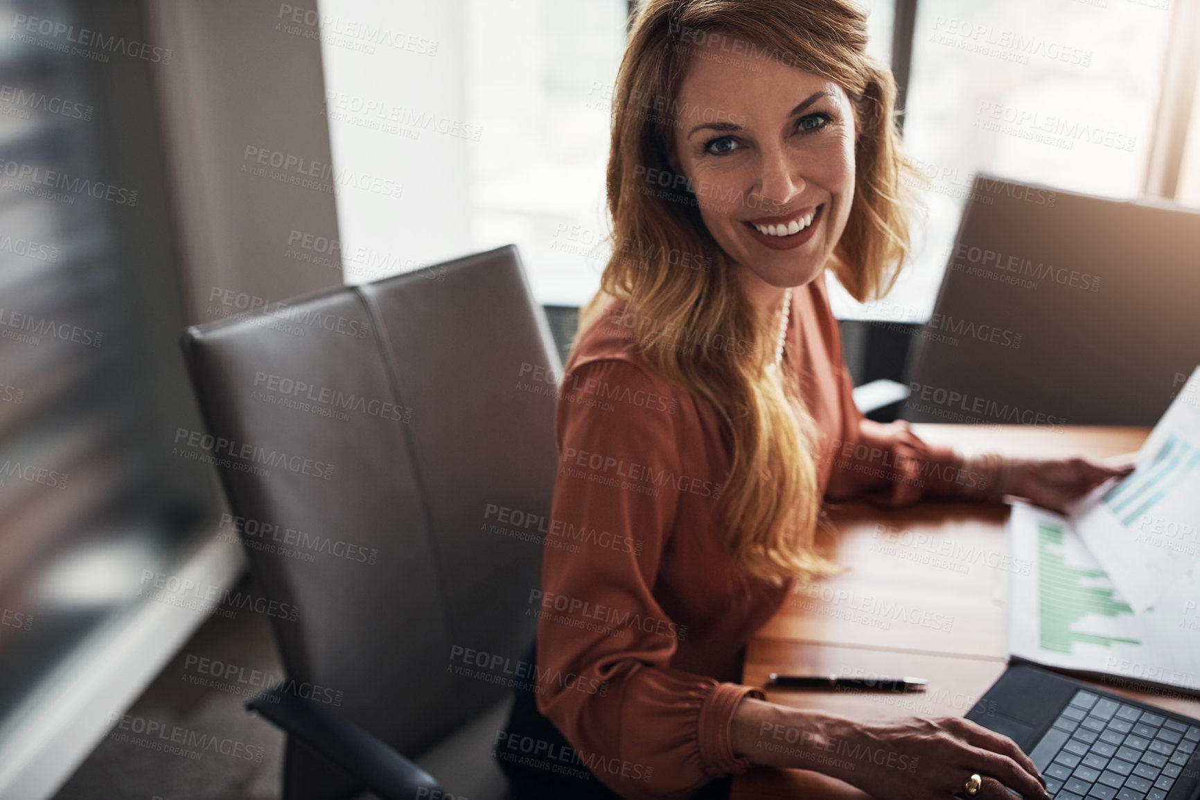 Buy stock photo High angle portrait of an attractive businesswoman working in her corporate office