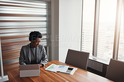 Buy stock photo High angle shot of an attractive businesswoman working in her corporate office