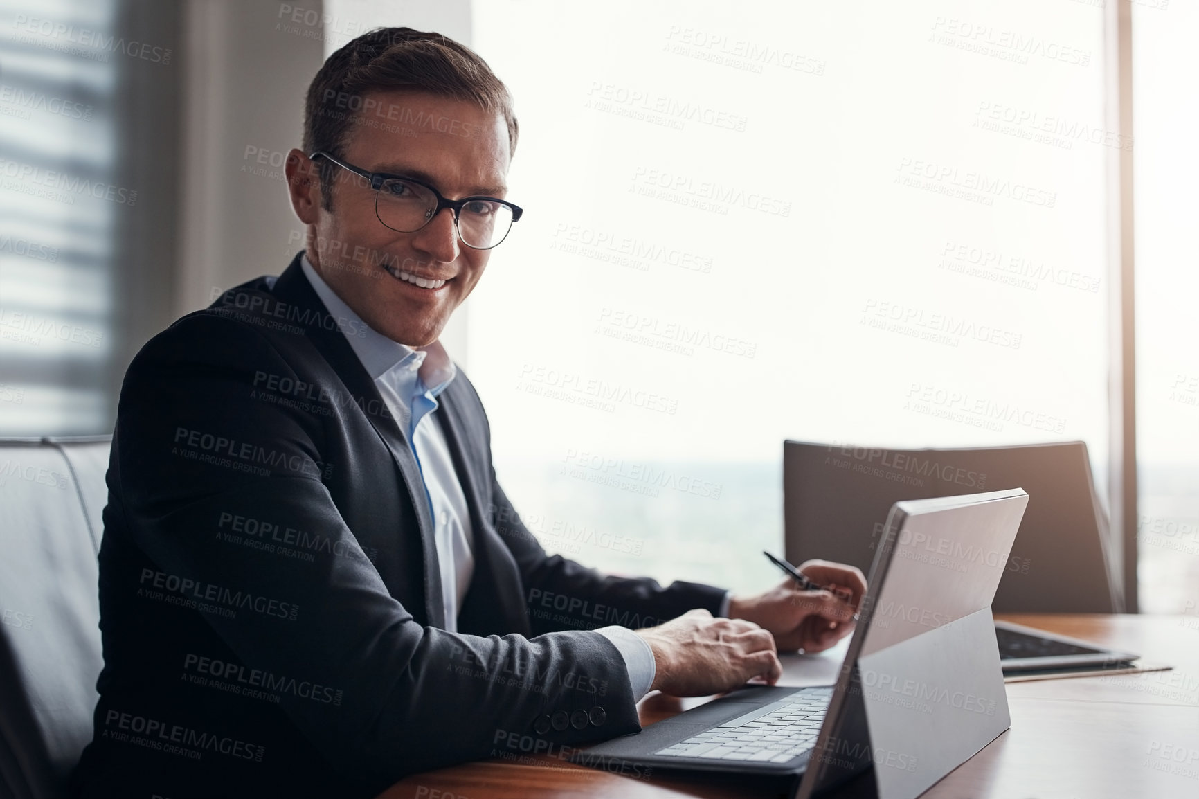 Buy stock photo Cropped portrait of a handsome businessman working in his corporate office