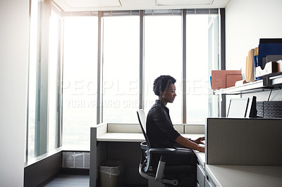 Buy stock photo Shot of a businesswoman working on her computer at her desk