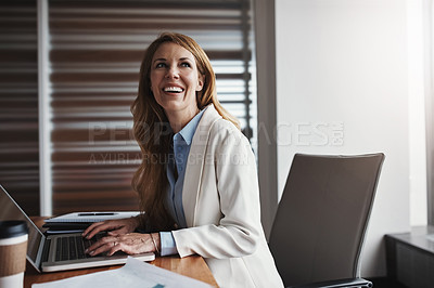 Buy stock photo Cropped shot of an attractive businesswoman looking thoughtful while working in her corporate office