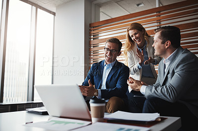 Buy stock photo Shot of businesspeople applauding a colleague in an office