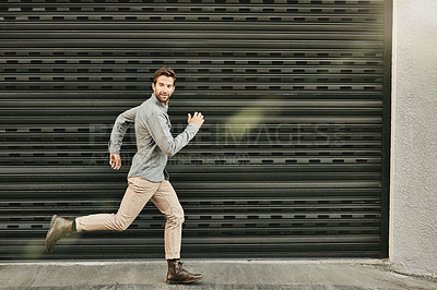 Buy stock photo Man, fashion and running with confidence outdoor on casual, style and elegant for office or job. Clothes, lens flare and smile for dreams or career opportunity, offer and ambition in New York