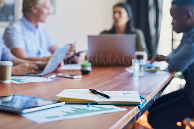 Buy stock photo Cropped shot of an open notebook on the table in a meeting room
