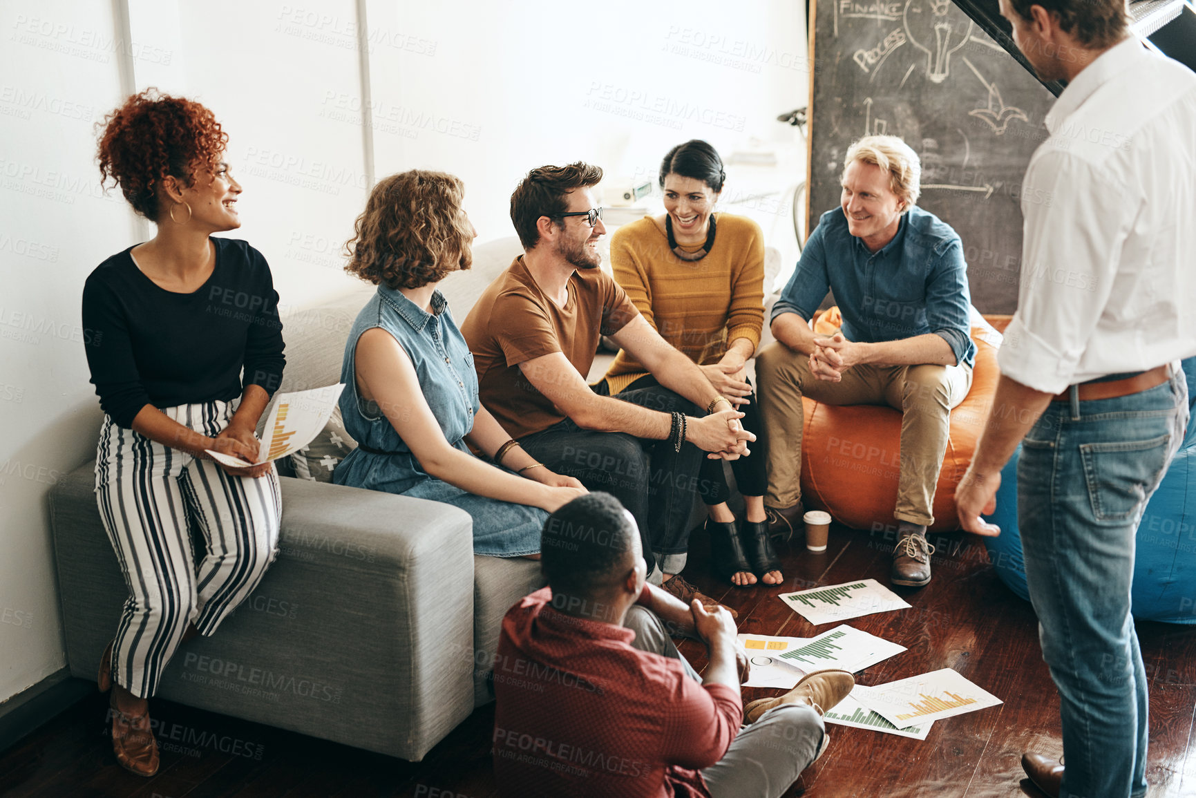 Buy stock photo Shot of a diverse group of designers brainstorming together in an office