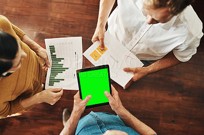 Buy stock photo High angle shot of a group of unrecognizable businesspeople brainstorming together in an office