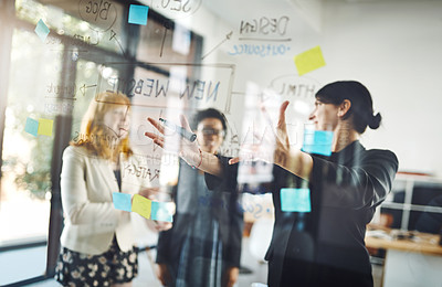 Buy stock photo Women, teamwork and pointing to notes on glass for schedule, mindmap and planning goals, agenda or objectives. Brainstorming, collaboration and presentation of ideas on window for startup innovation