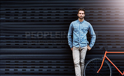 Buy stock photo Portrait, man and fashion with bicycle by wall for design of creative business worker by lens flare. Confident, male person and beauty with elegant clothing leaning grey brick for designer career
