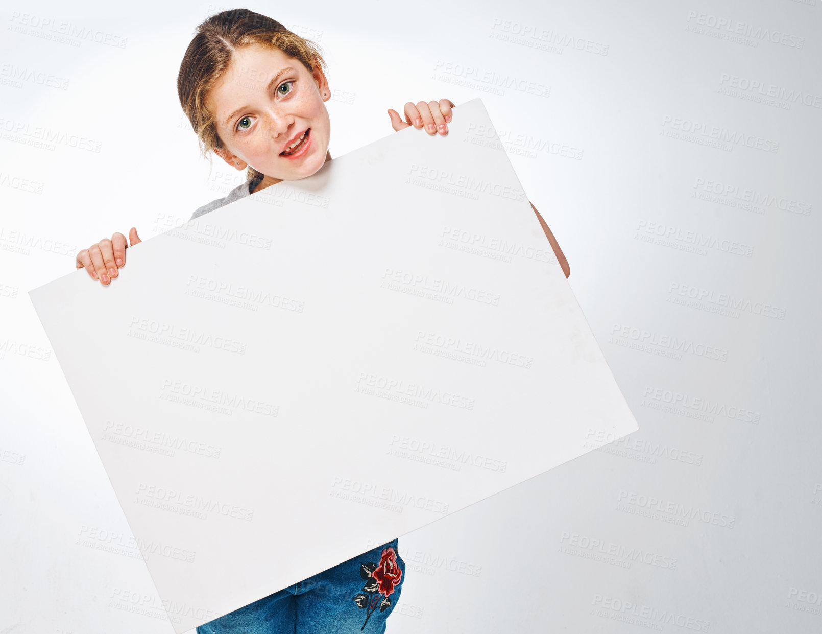 Buy stock photo Poster, happy and portrait of child in studio for news, announcement and information. Back to school, advertising and girl with sign, space or banner for sale, deal and bargain on white background