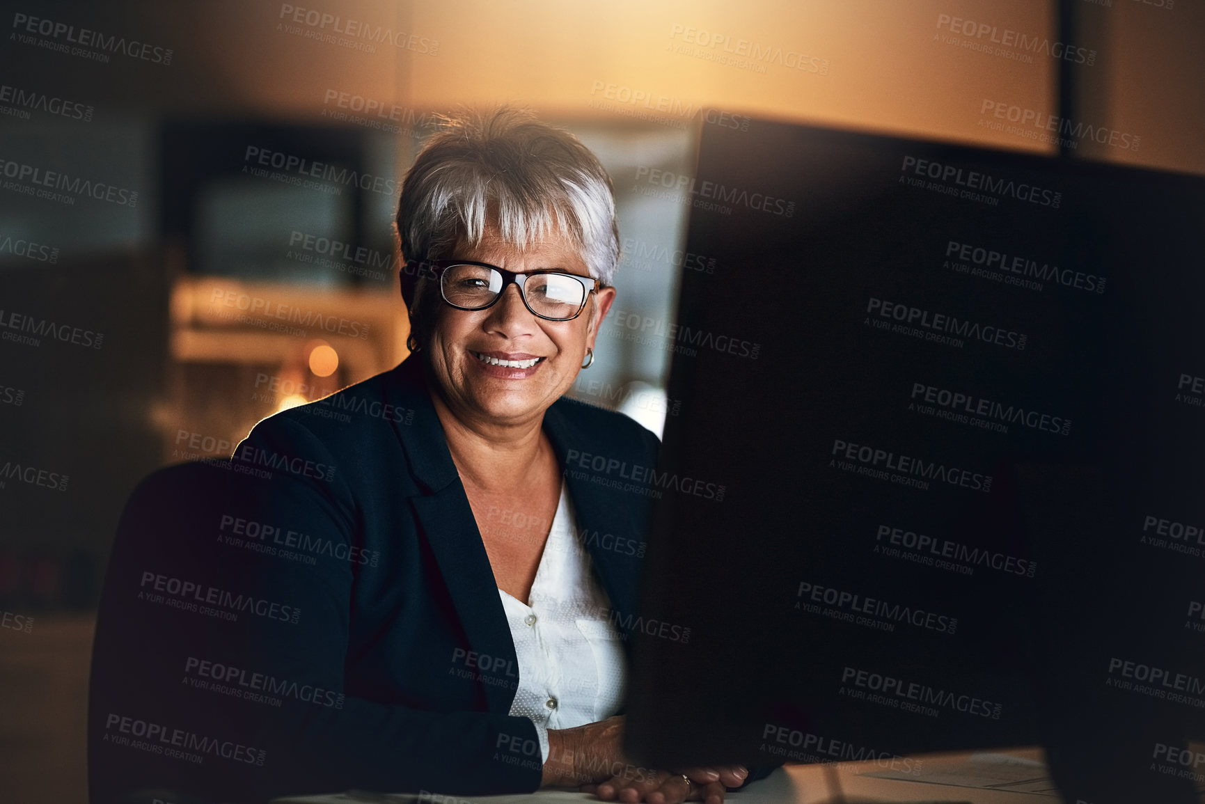 Buy stock photo Mature, business woman and computer in portrait at night as human resources specialist in office. Female person, working late and tech for connection, internet or company as professional in Argentina