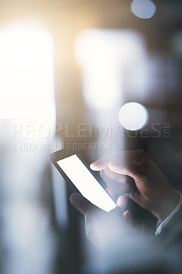 Buy stock photo Cropped shot of a businesswoman using a digital tablet during a late night at work 